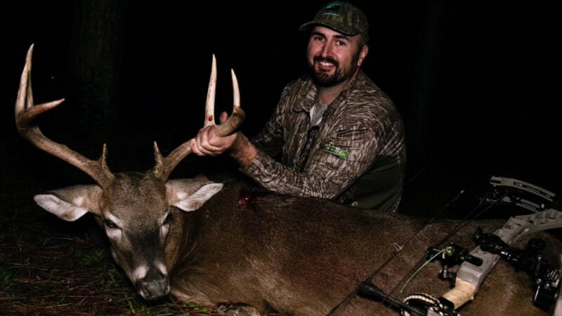 Jordan Blissett with a buck and a bow